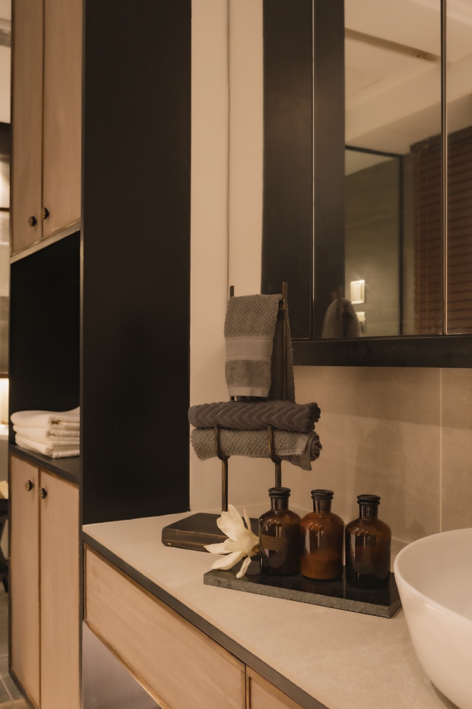 Primary bathroom basin and glass shower partition
