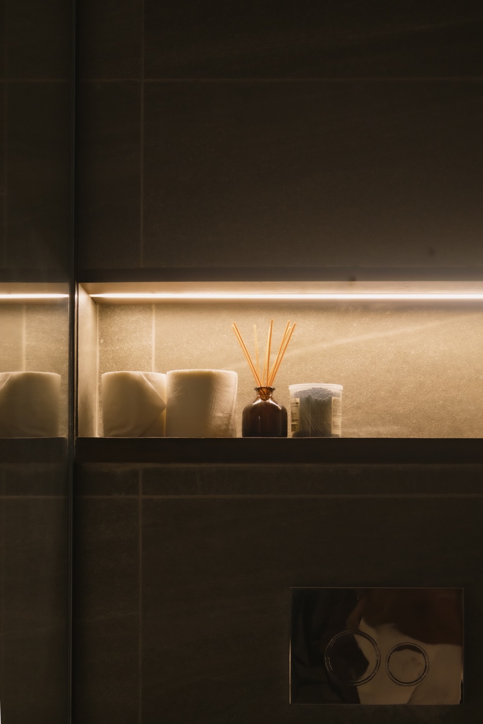 Recessed bathroom storage with concealed lighting