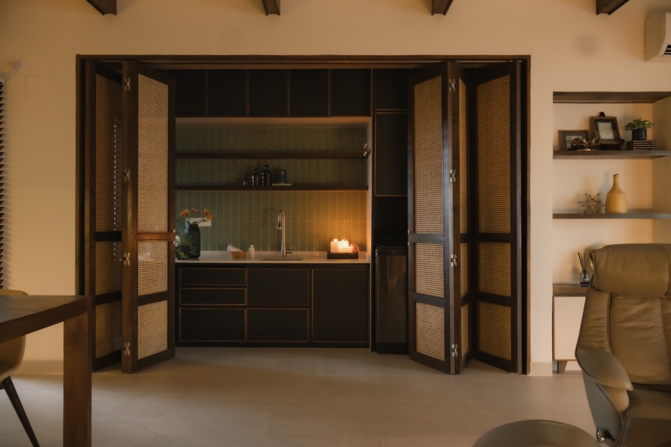 Rattan folding doors opening to reveal the laundry room
