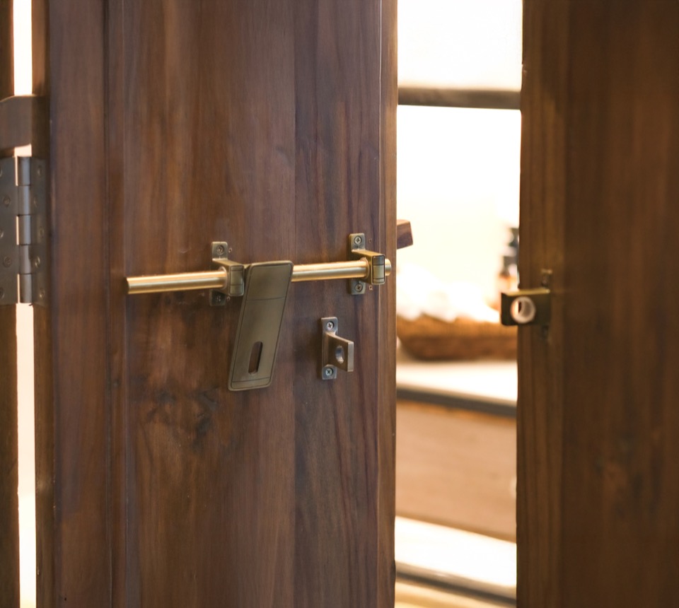 Traditional brass latch fitted to a pure teak door