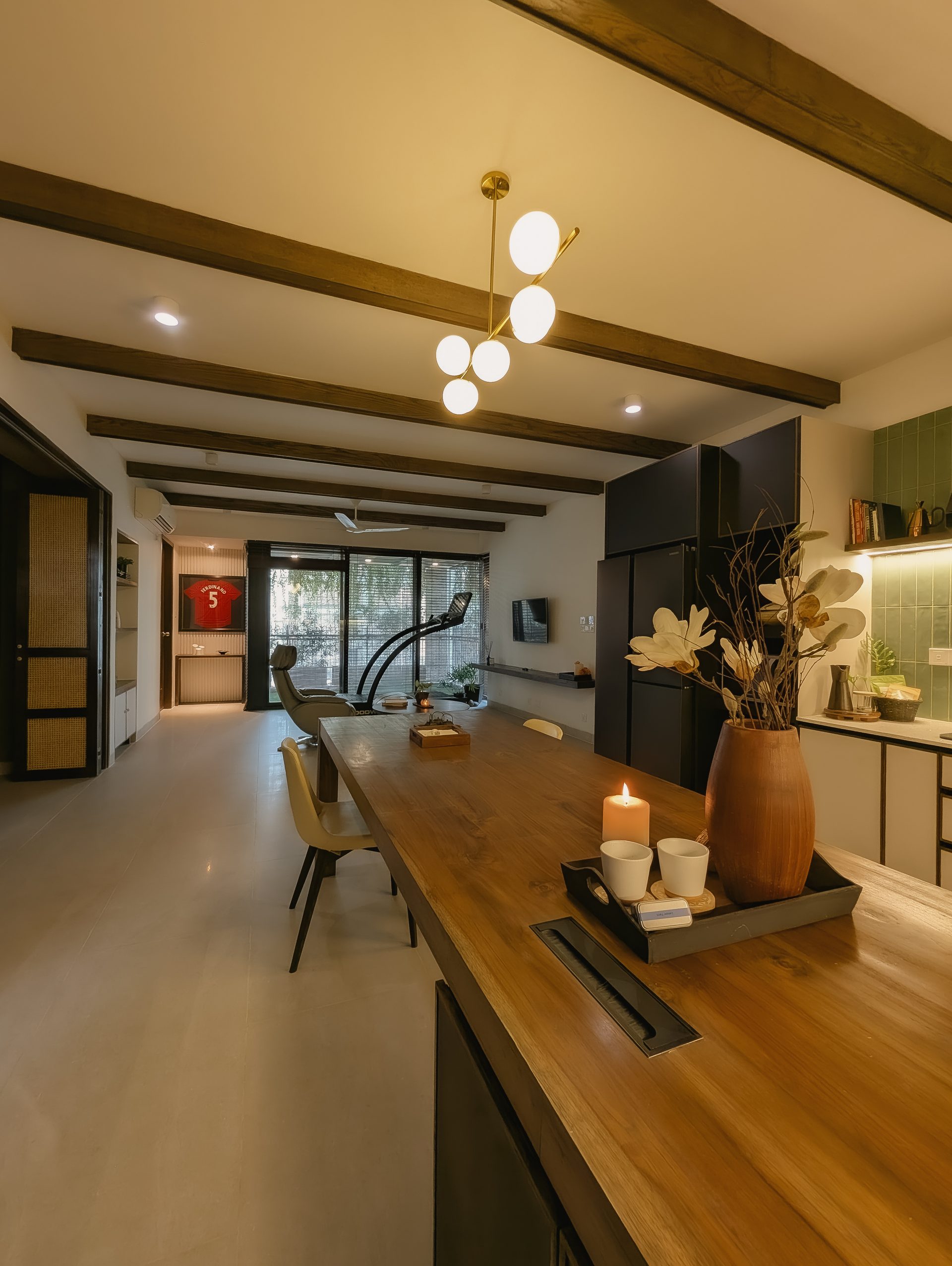 Getaway Home open kitchen and living spaces extending toward the planted balcony