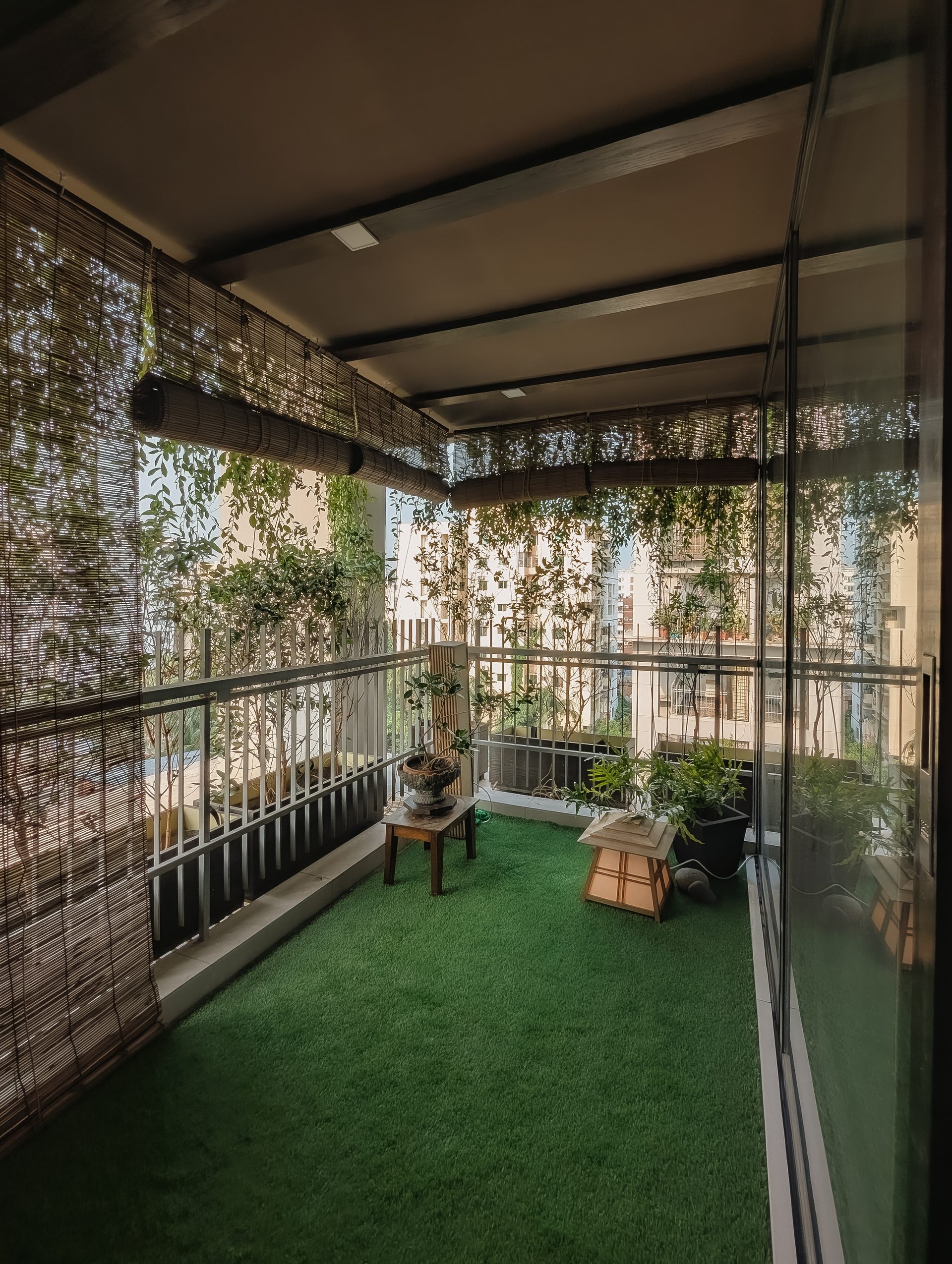 Planted veranda wrapped in bamboo blinds at the edge of Getaway Home