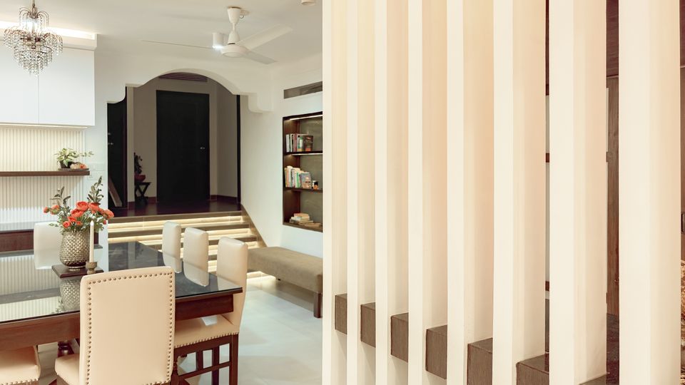 Dining room viewed through the vertical louver partition
