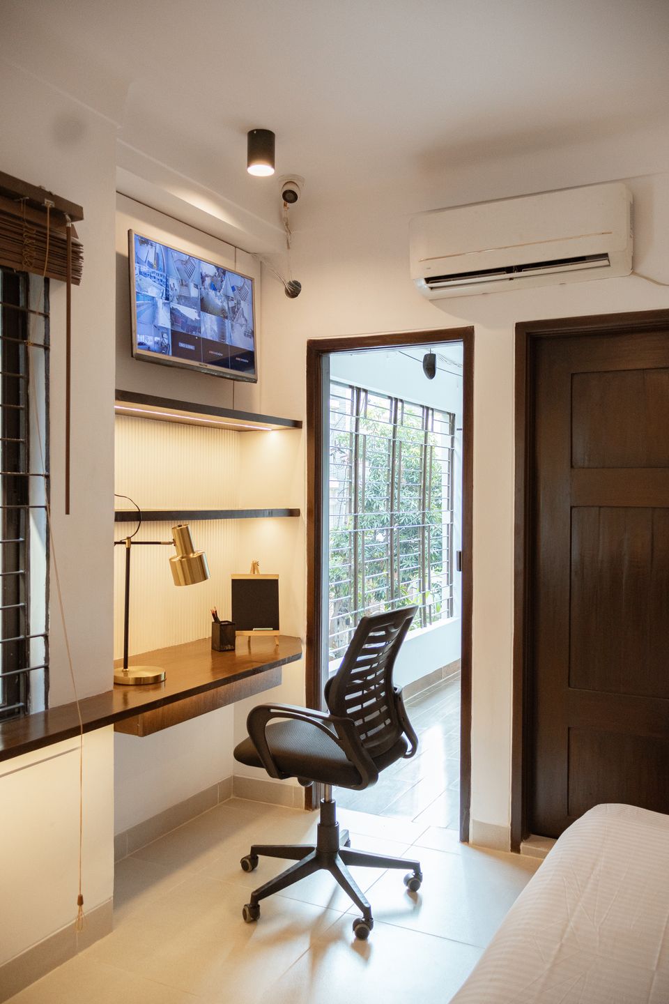 Window-side study desk with warm task lighting