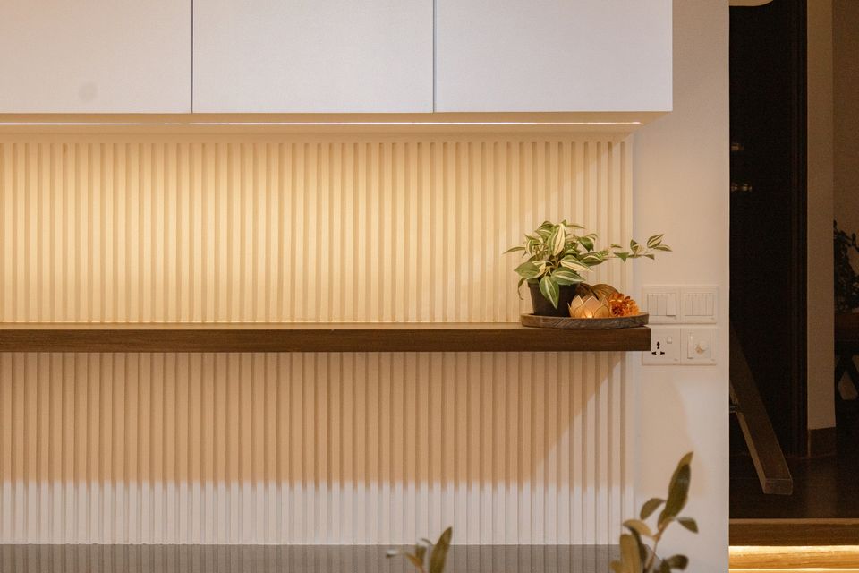 Long floating dining shelf with concealed lighting