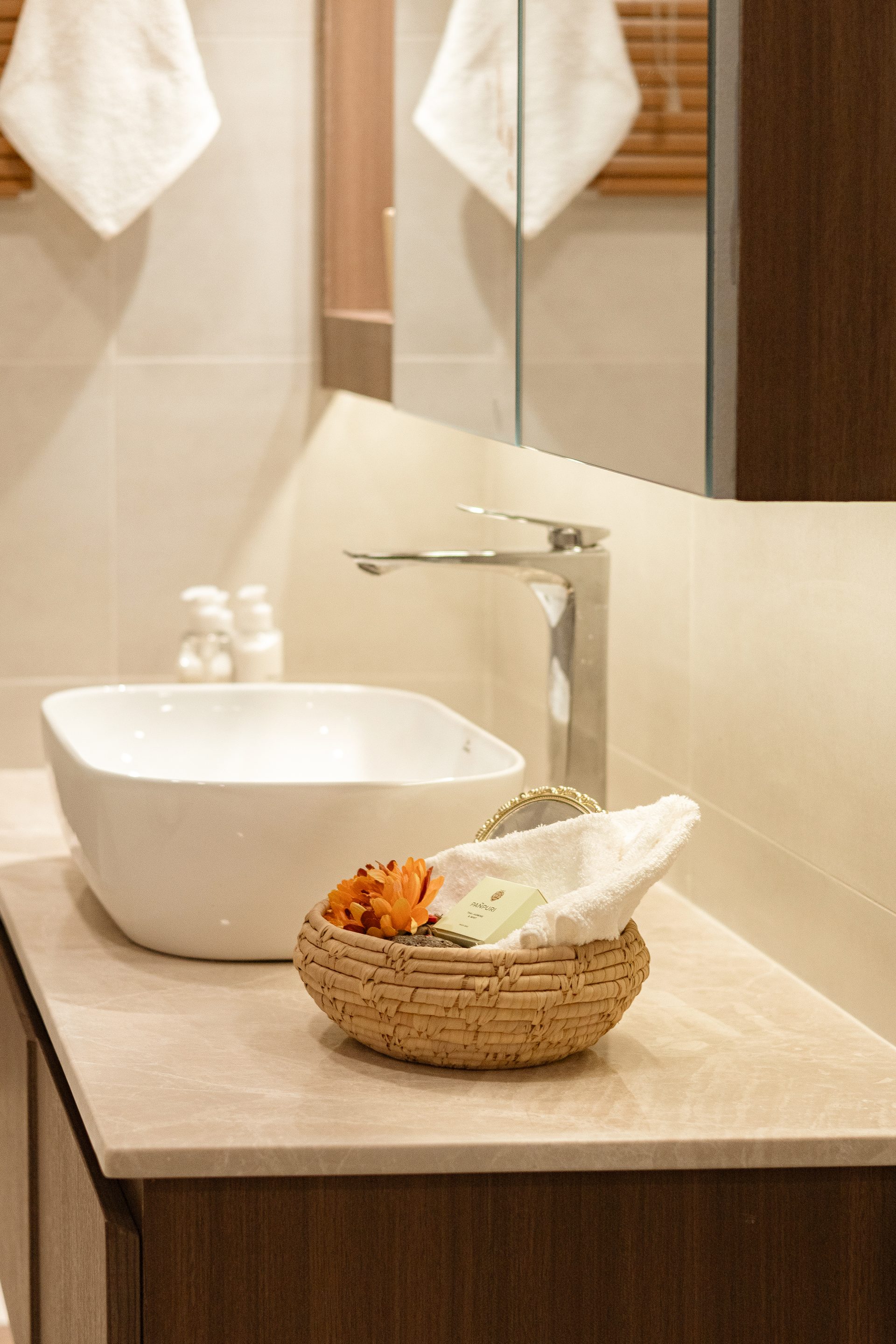 Bathroom basin and marble counter with a timber vanity below