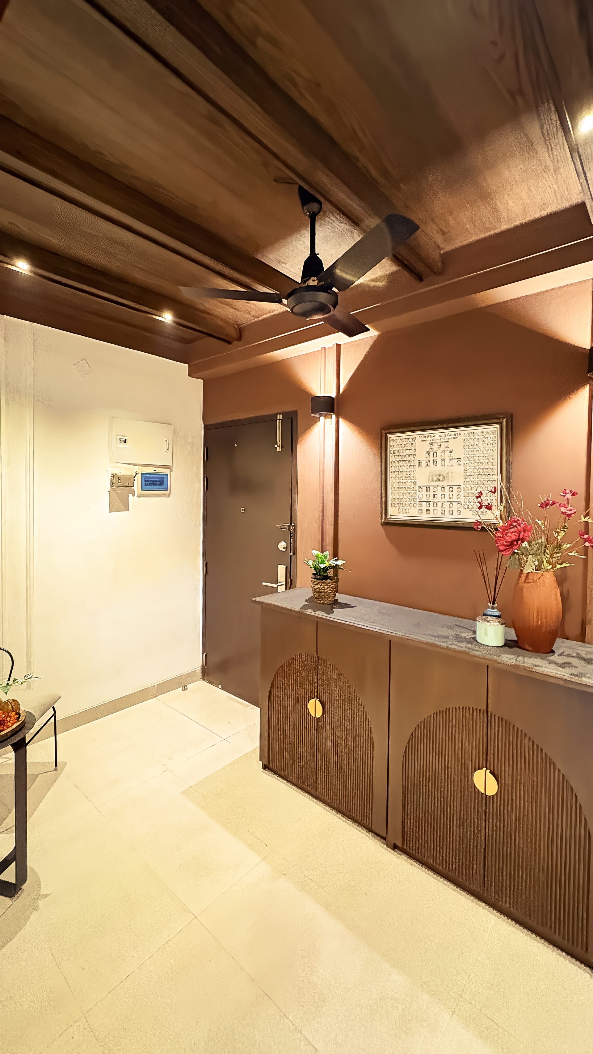 Tall view of the foyer console and dark entrance wall